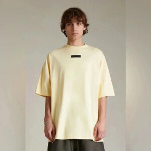 FEAR OF GOD ESSENTIALS Logo-appliqué Cotton T-shirt in Pastel Yellow Size Small